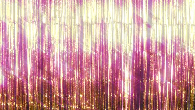 Dazzling foil tinsel fringe background with a soft filter with glimmering and sparkling highlights - copy space