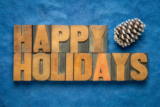 Happy Holidays greetings in wood type - Powered by Adobe