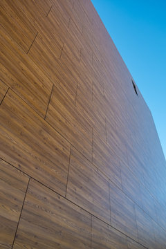 Architectural facade covered with wooden pattern HPL boards