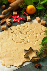Culinary christmas background. Dough and ingredients for baking gingerbread.
