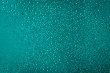 blue water drops on aqua, quetzal green color  background