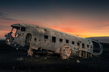 Fototapeta na wymiar Airplane wreck in black sand beach in Iceland