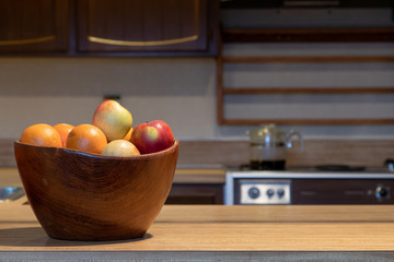 Wooden Bowl on Kitchen Counter with Fruit