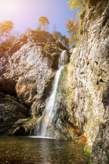 Fototapeta na wymiar Beautiful waterfall landscape in Austria, autumn time. Pötz, Koppl