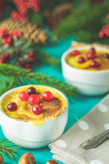 Christmas and New Year composition with sweet delicious apples dessert, spruce branches, cutlery on blue turquoise wooden table surface, copy spice