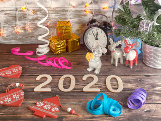 Happy new year 2020. Symbol: rat on wooden background.
