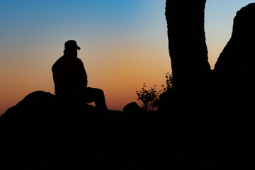 Fototapeta na wymiar silhouette of man on background of sunset