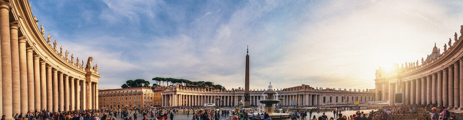 Fototapeta na wymiar Vatican City, Rome, Italy - Circa October 2019: Panorama of Piazza San Pietro square and Basilica di San Pietro at Vatican City with tourists on street in sunset.