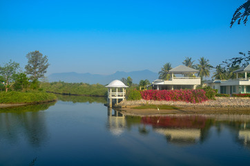 Obraz premium Colourful tropical buildings. Coastal landscape waterscape with