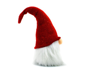 Gnome a Christmas elf wearing big red with glitters hat and standing on white background