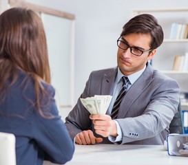 Businessmanbeing offered bribe for breaking law