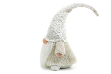 Gnome a beautiful christmas elf in thick warm coat with gift bag standing on white background