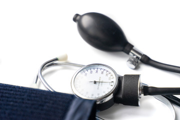Blood pressure monitor and stethoscope. Medical sphygmomanometer for blood pressure control on white