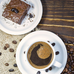 Cup of black coffee and cake