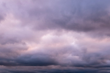 Stormy sky. Purple cloudscape for background..