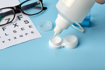 Flat composition with contact lenses, table for eye examination. Accessories for ophthalmologists....