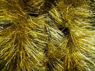 Beautiful tinsel, great design for any purposes. New year card. Bright tinsel, Christmas background, shiny pattern. Colorful decoration.