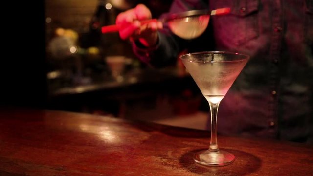 La Bruja authorial drink being prepared. Defocused pub background. Fixed plane.