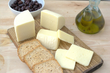 Typical cow cheese from Spain on a wooden board