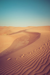Fototapeta na wymiar Dubai sand dunes in the desert with foot prints