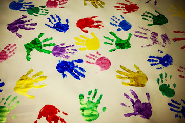 Obraz premium Children hand prints on white wall background,selective focus