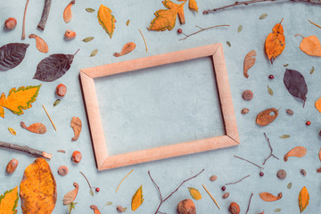 Autumn decoration and blank picture frame flat lay top view