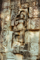 Stone statues of faces in Cambodian Angkor Wat Temple near Siem Reap city in Asia