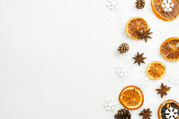 Christmas winter spices. Star anise, orange slices isolated over a white background.