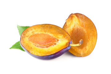 plum slices with green leaves isolated on a white background