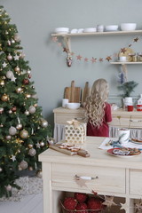 Christmas tree in the New Year decorated kitchen