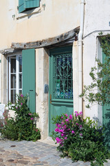 Fototapeta na wymiar House with green blinds