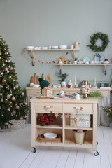 Christmas tree in the New Year decorated kitchen