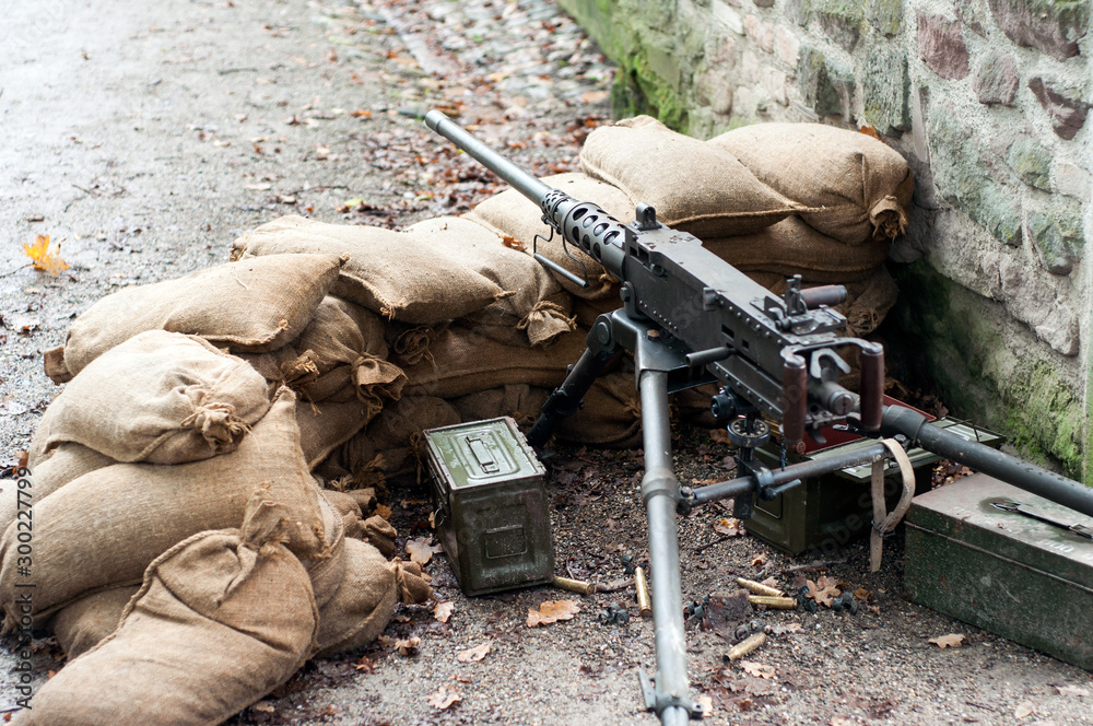 Wall mural closeup of american machine gun during the world war two reconstitution for the 75 th anniversary of