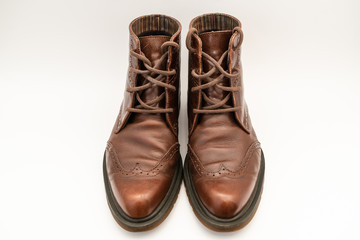 Vintage brown boots on white background, retro shoes
