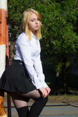 Outdoor portrait of young lady walking on the park.