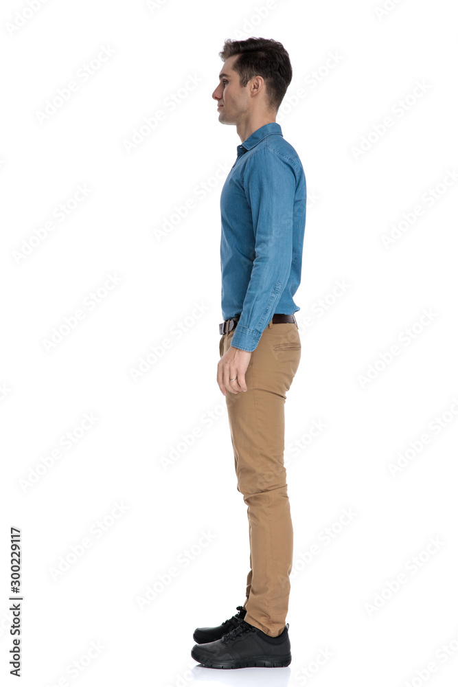 Wall mural side view of smart casual man waiting in line