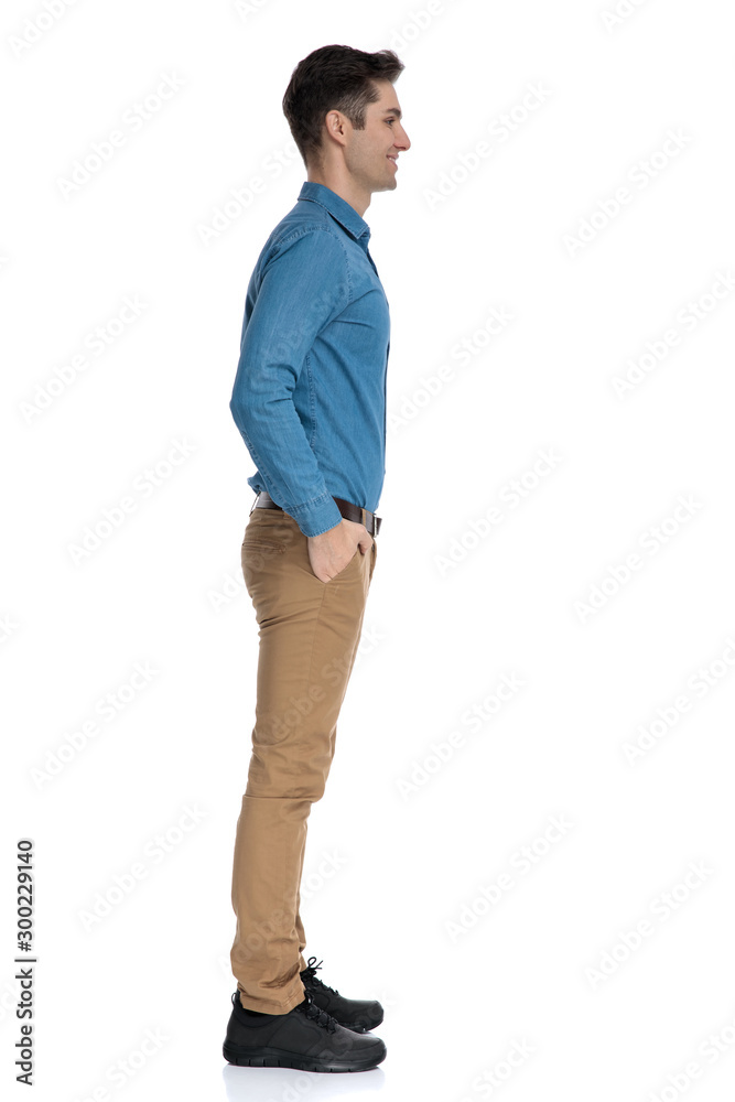 Poster happy young man waiting in line and smiling