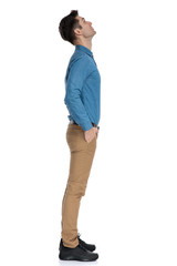smart casual model looking up and waiting in line