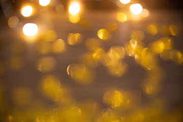 New Year and Christmas celebration. Abstract of blurry lights. Golden bokeh. The lights are out of focus