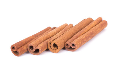 Cinnamon Sticks Stacked isolated on White background closeup macro shot