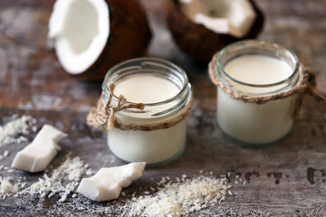 Coconut milk in jars. Vegan diet. Vegan milk.