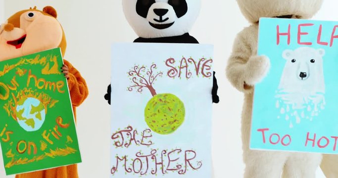 Polar bear and animal mascots characters with a message for humanity, about global warming and pollution problems on our planet