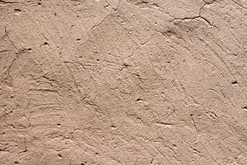 Old cob wall with cracked surface