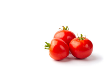 Three fresh Kherson red tomatoes on a white background isolate with copy space