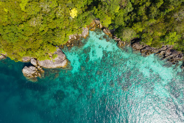 Aerial view from a drone of beautiful Nyaung Oo Phee island on sunny day in Myanmar.