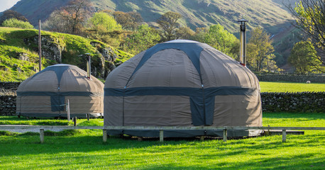 Yurts in a field