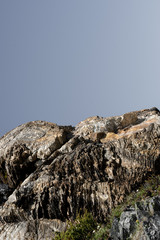 Vertical photograph of a rocky cliff in Finnish Lapland, hike to the three Nation's border