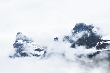 Mountains covered in snow. Foggy winter landscape