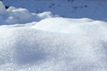 Fototapeta na wymiar sparkling texture of natural white snow in winter