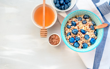 buckwheat porridge with fruits and honey, chia seeds, flax seeds, the concept of a healthy breakfast, diet, veganism, vitamins
